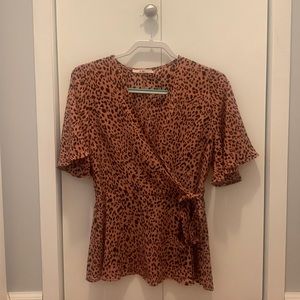 A cheetah print shirt designed by Mi Ami, size medium.